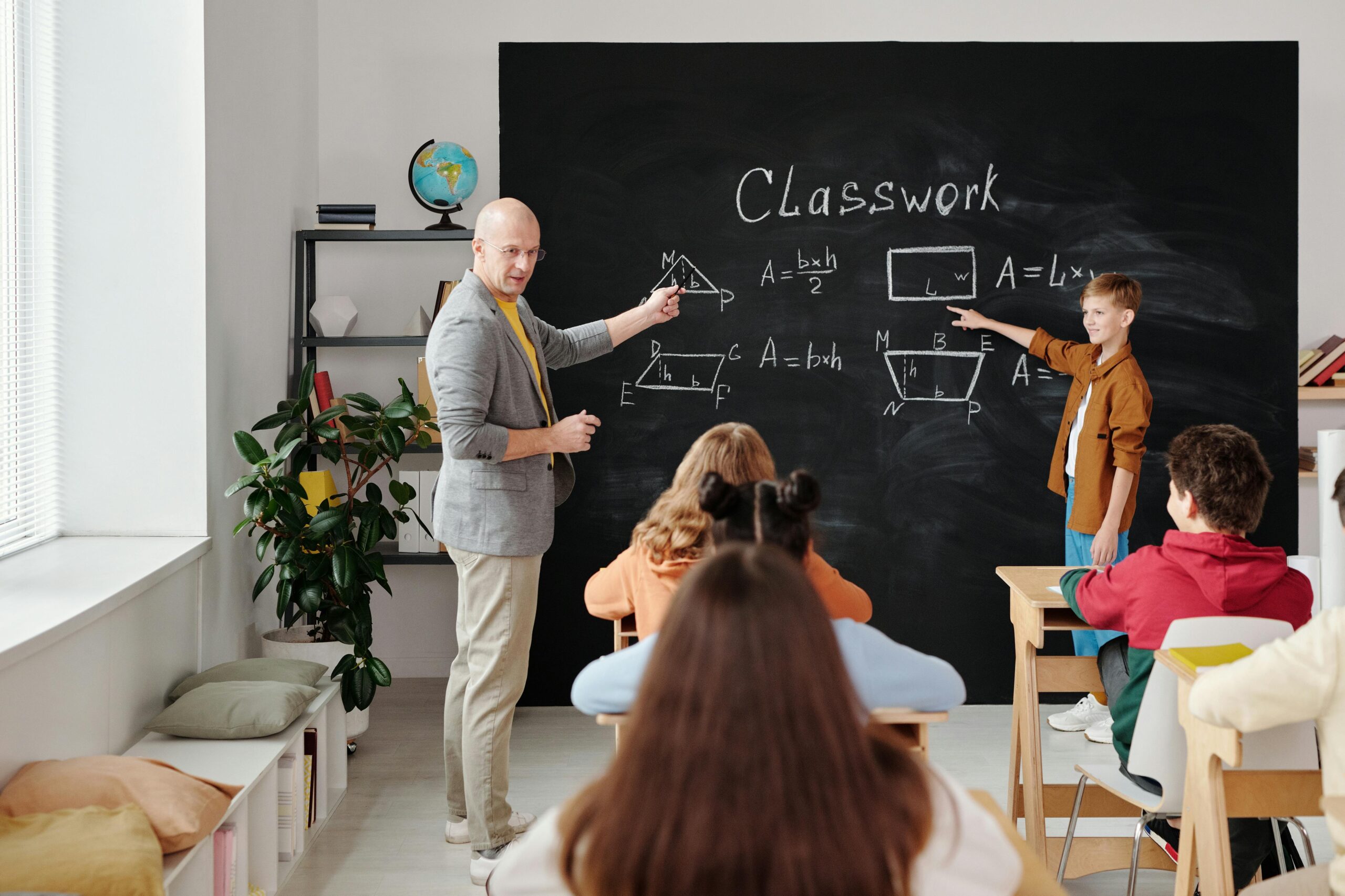 A classroom with students solving a math equation.